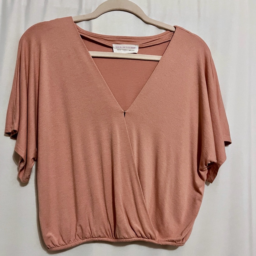 Lighter pink blouse, can unbutton in front, size medium